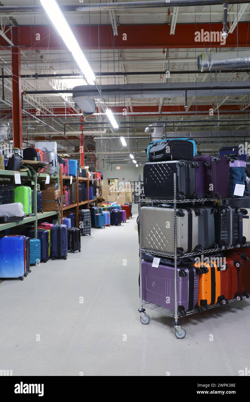 Various suitcases and luggage in storage room Stock Photo