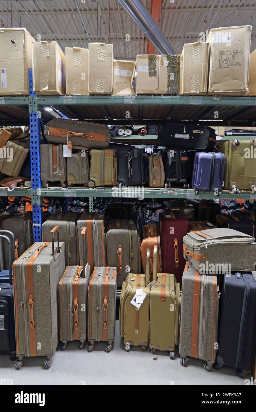 Various suitcases and luggage in storage room Stock Photo