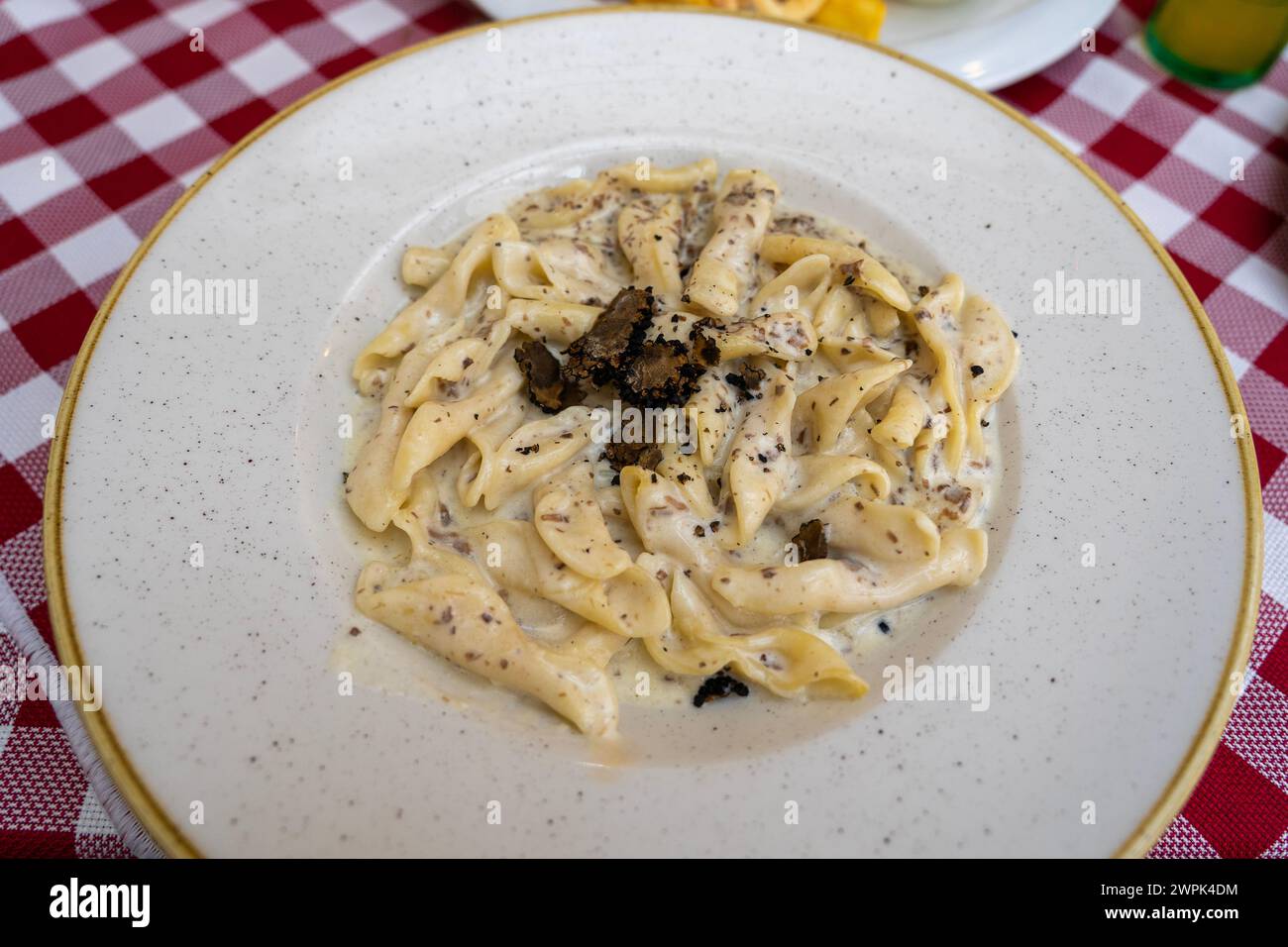 fuzi istrian pasta with black truffle tartufo mashroom and cream traditional food in Rovinj Croatia . Stock Photo