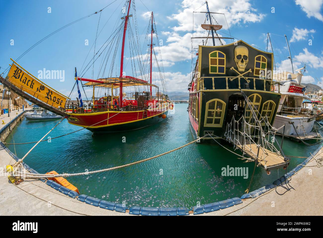 Hersonissos, Crete, Greece - July 23, 2021: Tourist ships imitating pirate ships in the port of the city. Stock Photo