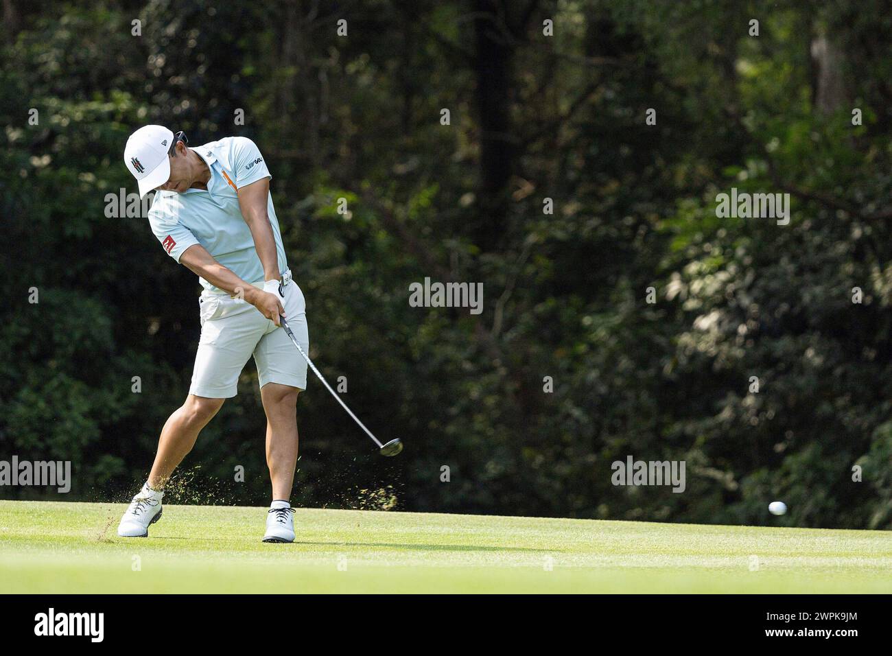 Jinichiro Kozuma of Iron Heads GC hits his shot during the first round
