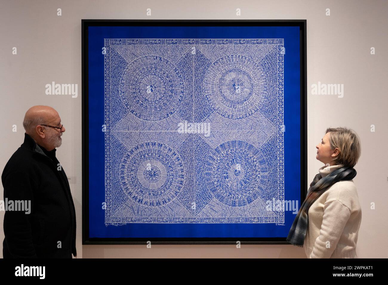 October Gallery, London, UK. 8th March, 2024. Celestial Blue is a solo exhibition of new works by the renowned Algerian artist Rachid Koraïchi (photograph). Image: The Artist with Alana Pryce Tojcic of October Gallery. Credit: Malcolm Park/Alamy Live News Stock Photo