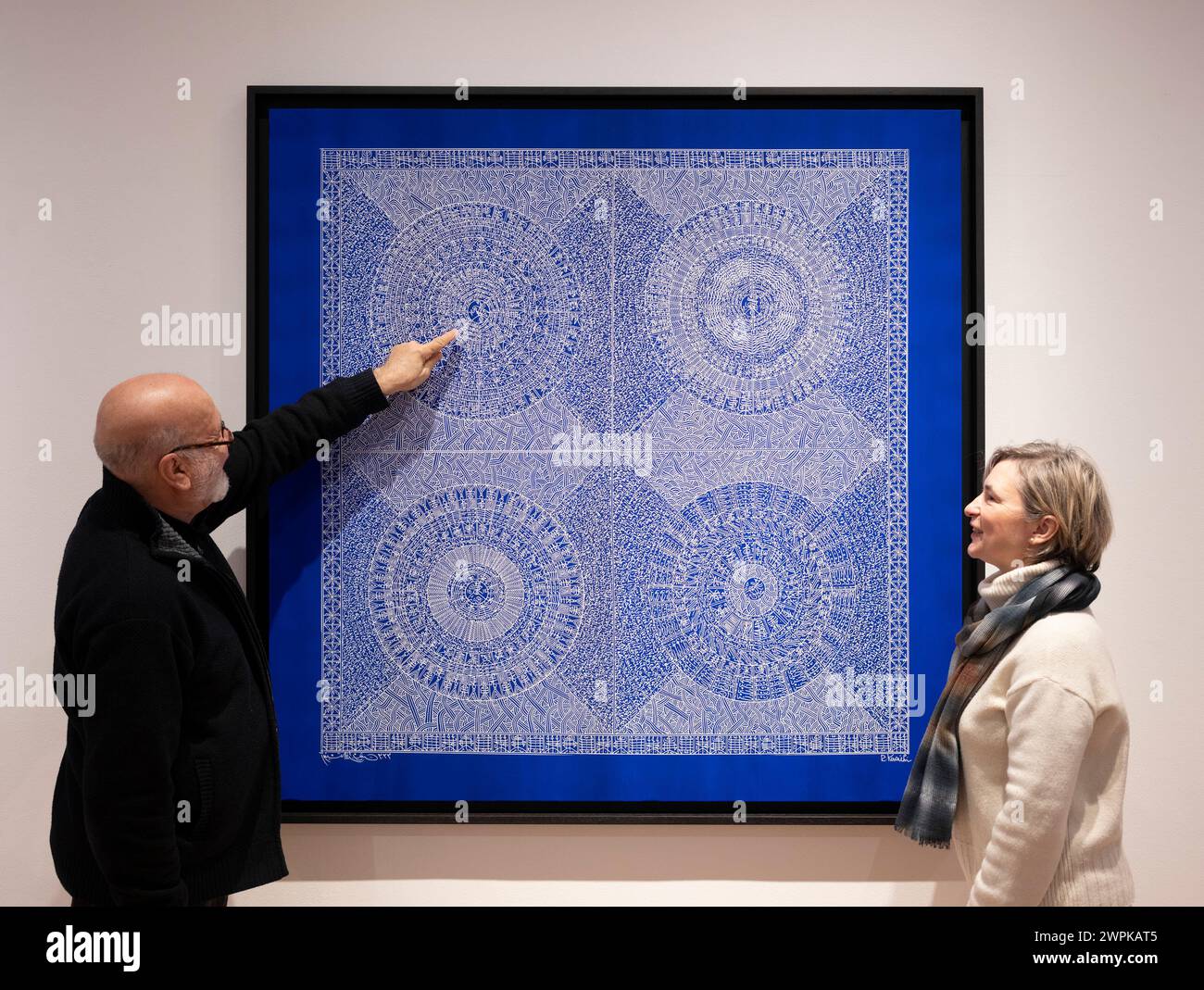 October Gallery, London, UK. 8th March, 2024. Celestial Blue is a solo exhibition of new works by the renowned Algerian artist Rachid Koraïchi (photograph). Image: The Artist with Alana Pryce Tojcic of October Gallery. Credit: Malcolm Park/Alamy Live News Stock Photo