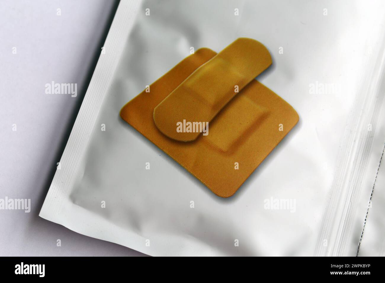 Bandaid package with photo of different kinds of bandaids on top of it ...