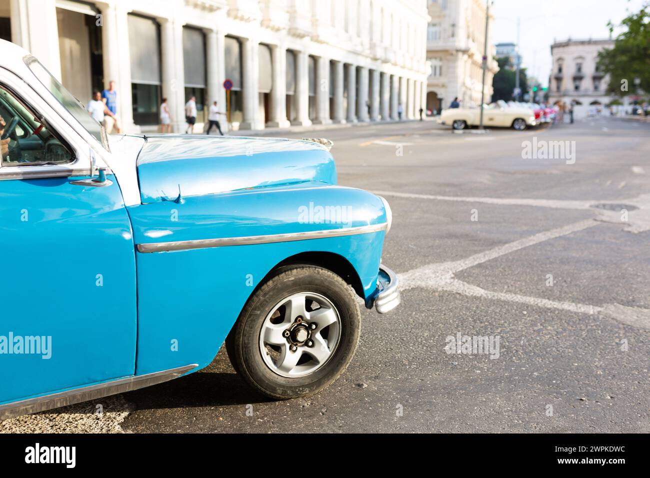 Blue vintage car front cruising Havana's streets Stock Photo