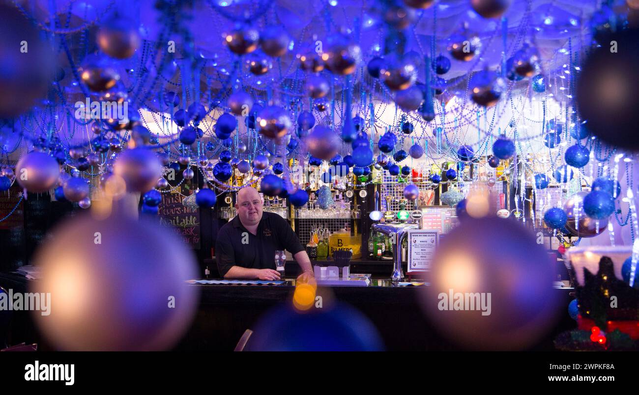 28/11/14  Landlord and pub owner, Mark Thomas, 41, in the bar.  The Hanging Gate pub in Chapel en le Frith, in the Derbyshire Peak District claims to Stock Photo