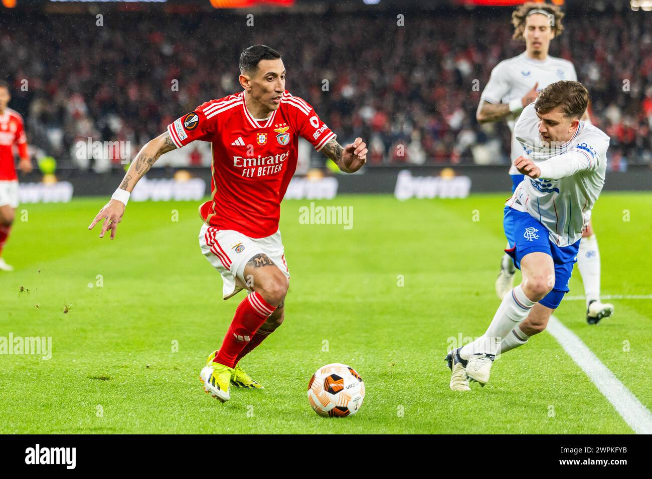 Lisbon, Portugal. 07th Mar, 2024. Angel Di Maria (L) of SL Benfica and Ridvan Yilmaz (R) of Rangers seen in action during the UEFA Europa League 2023/24 match between Benfica and Raners at Estadio do Sport Lisboa e Benfica. Final score; Benfica 2 - 2 Rangers. Credit: SOPA Images Limited/Alamy Live News Stock Photo