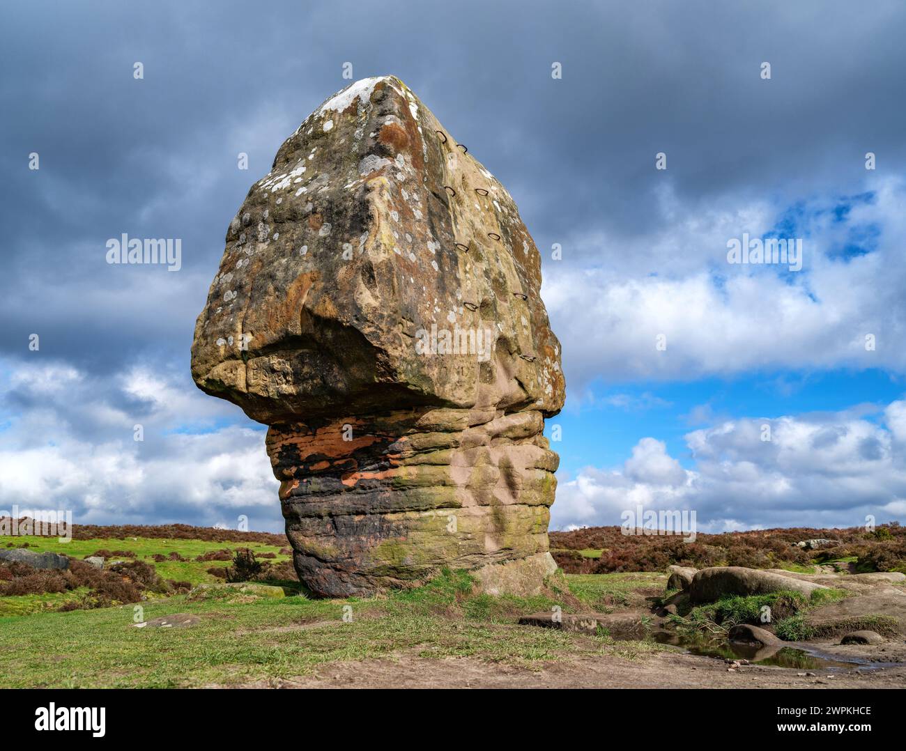 The Cork Stone a naturally eroded sandstone pillar on Stanton Moor near Birchover in the Derbyshire Peak District UK Stock Photo