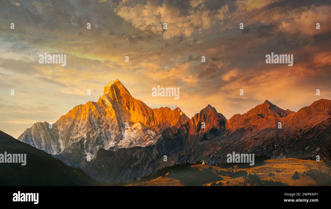 Dramatic sunset over mountain range silhouette Stock Photo