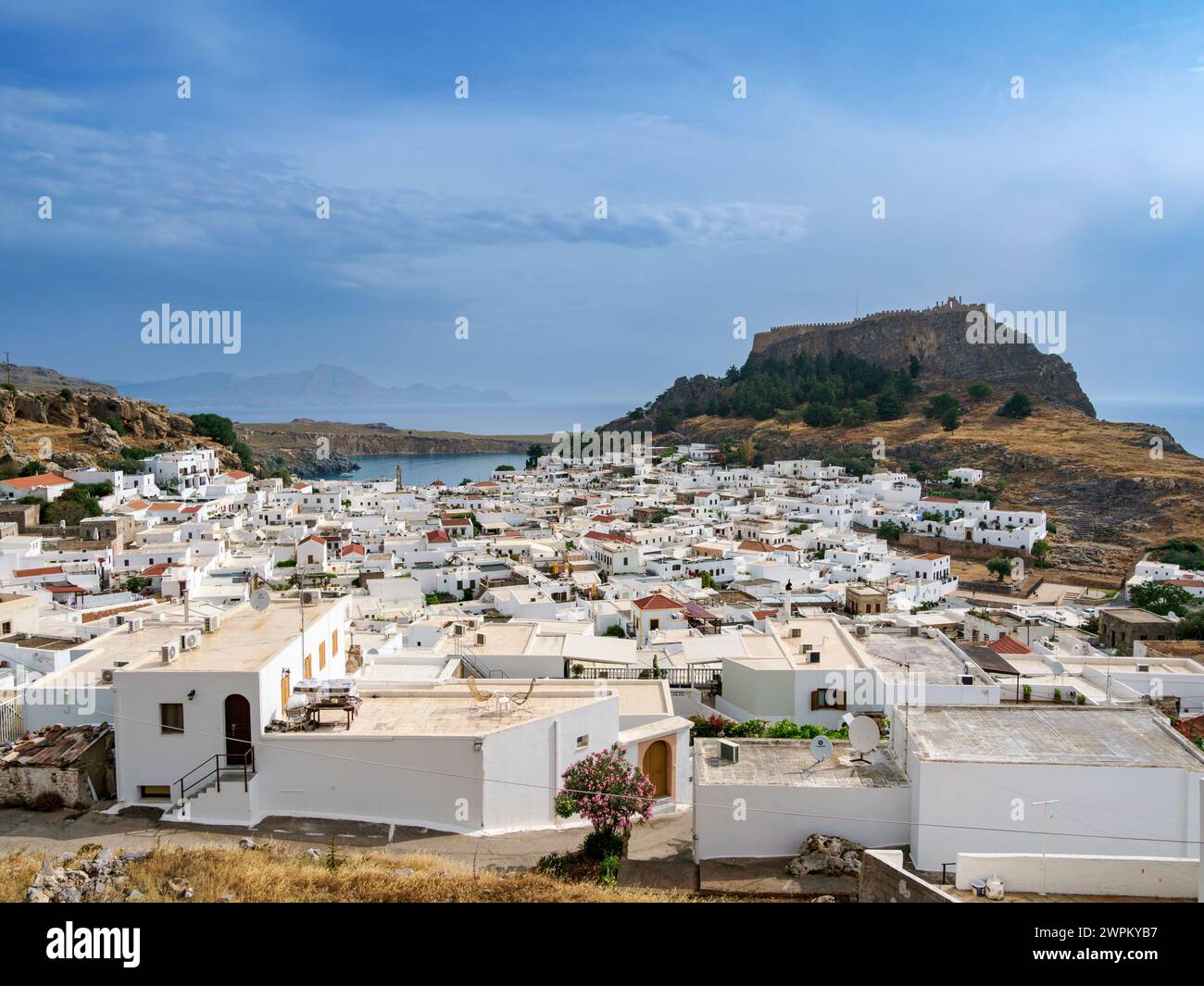 View over Lindos village towards the Acropolis, Rhodes Island, Dodecanese, Greek Islands, Greece, Europe Stock Photo
