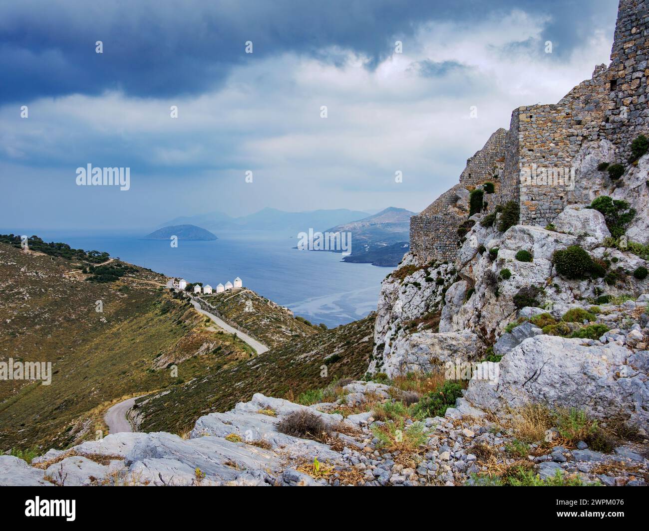 Medieval Castle and Windmills of Pandeli with stormy weather, Leros Island, Dodecanese, Greek Islands, Greece, Europe Stock Photo