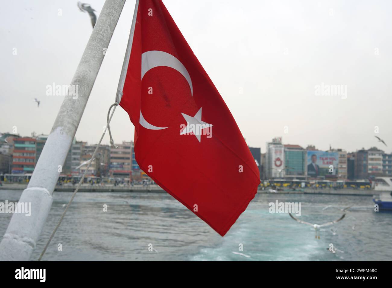 The Turkish flag flying from the back of the ferry across the Bosphorus Stock Photo