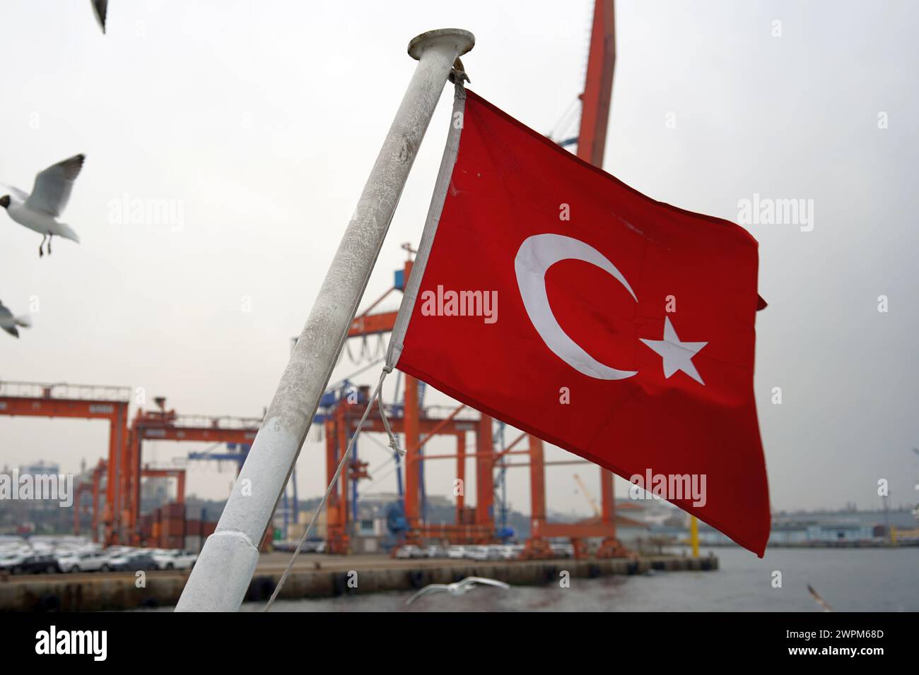 The Turkish flag flying from the back of the ferry across the Bosphorus Stock Photo