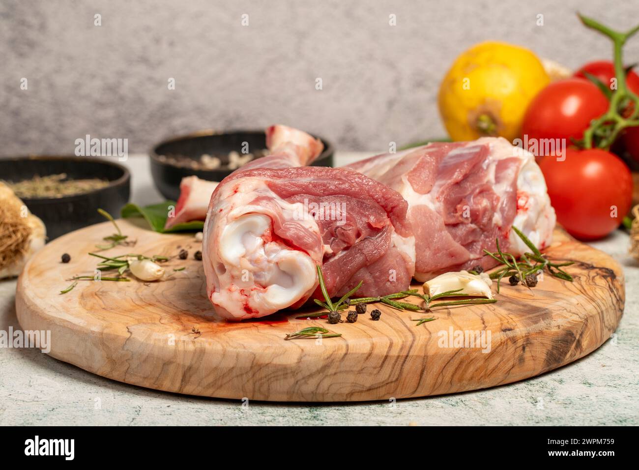 Lamb's shank. Butcher products. Lamb shank steak with bones on stone background Stock Photo