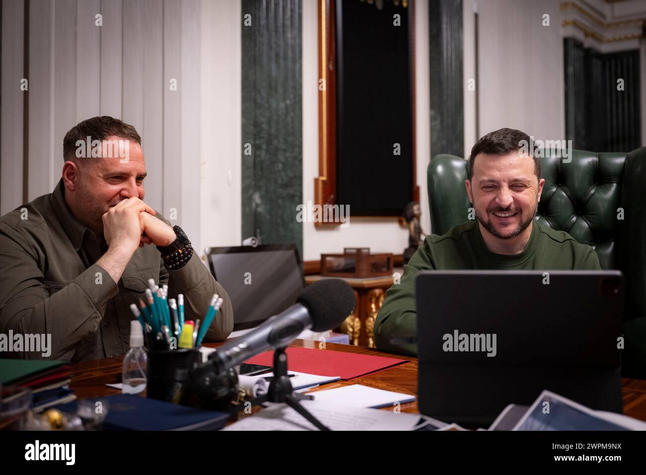 Kiev, Ukraine. 07th Mar, 2024. Ukrainian President Volodymyr Zelenskyy, right, and chief of presidential staff Andriy Yermak, left, hold a video call with Mstyslav Chernov, director of the documentary film “20 Days in Mariupol' from the Mariinsky Palace, March 8, 2024 in Kiev, Ukraine. The Ukrainian filmmaker has won the Directors Guild of America Award, the BAFTA award and is nominated for the upcoming Academy Award. Credit: Ukraine Presidency/Ukrainian Presidential Press Office/Alamy Live News Stock Photo