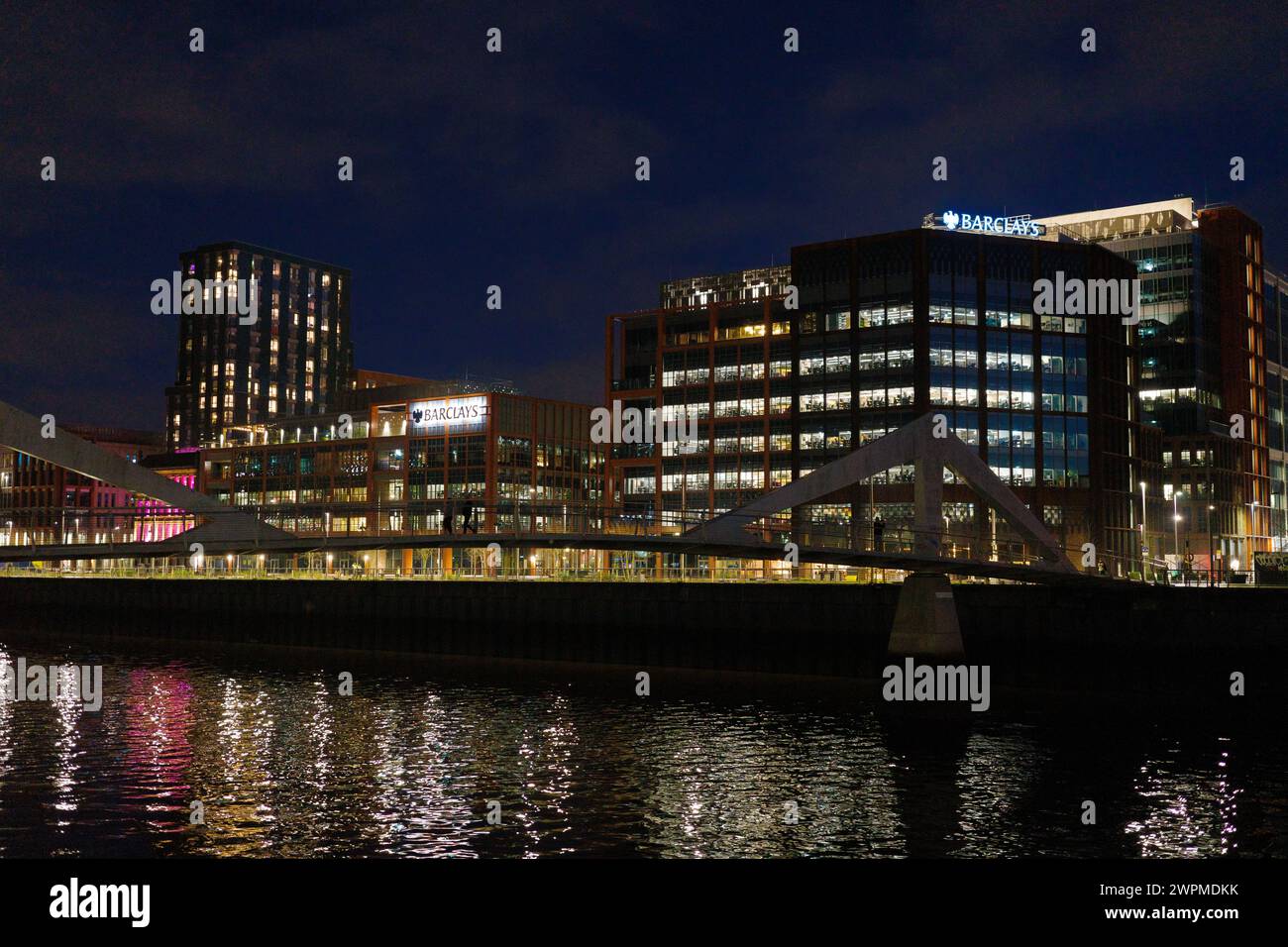 Glasgow Scotland: 11th Feb 2024: exterior Barclays Clyde Place with river refelction at night. Barclays Bank offices Stock Photo