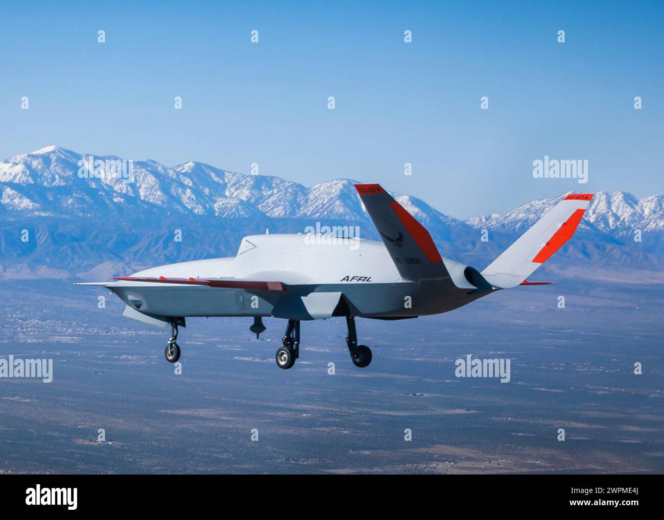 Palmdale, United States. 28 February, 2024. A U.S Air Force XQ-67A OBSS, highly autonomous, tactical stealth unmanned air vehicle, soars overhead during the maiden flight at Gray Butte Field Airport, February 28, 2024 in Palmdale, California. The XQ-58A Valkyrie is designed to escort manned fighter aircraft during combat missions. Credit: John James/U.S Marines/Alamy Live News Stock Photo