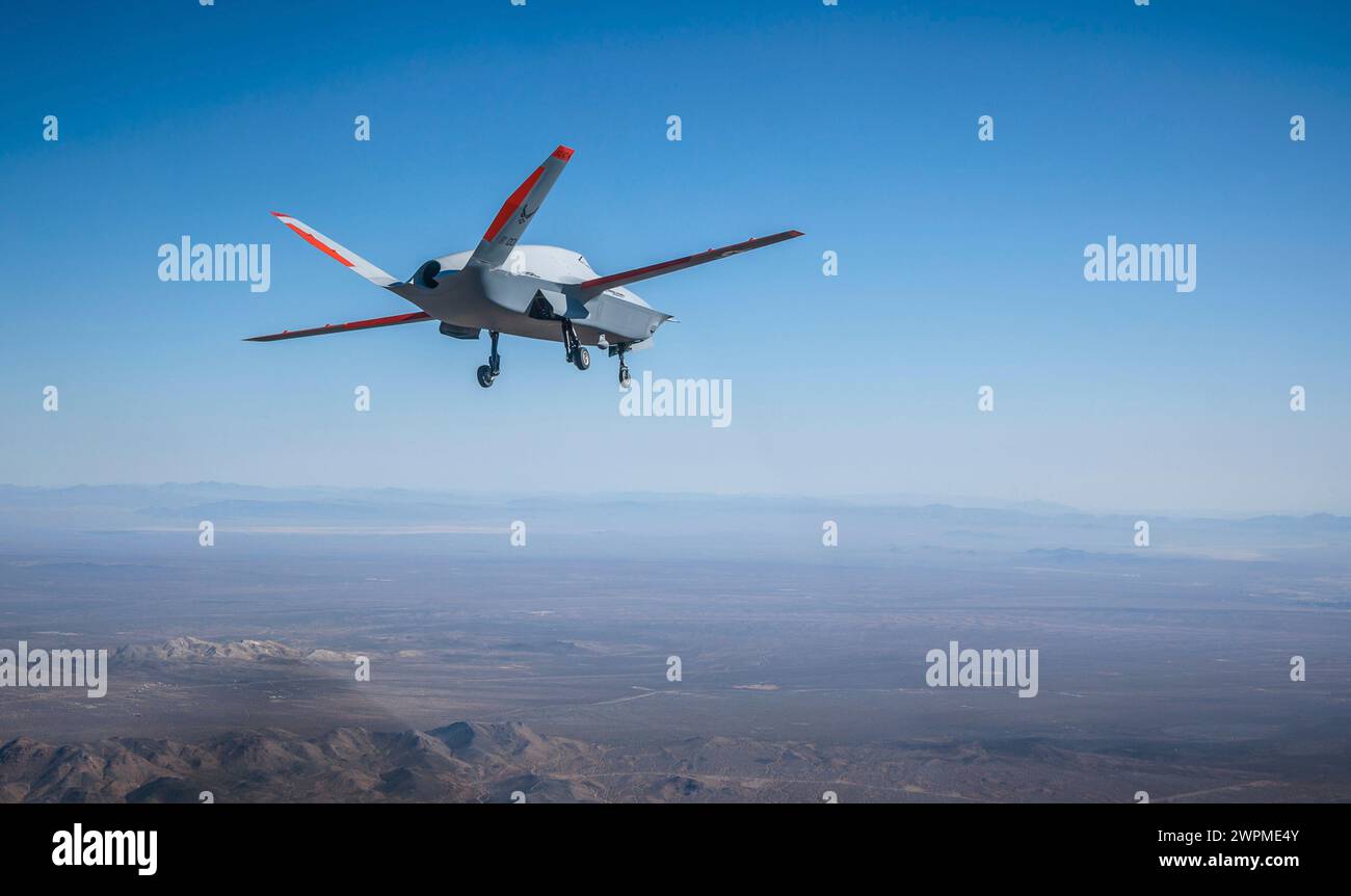 Palmdale, United States. 28 February, 2024. A U.S Air Force XQ-67A OBSS, highly autonomous, tactical stealth unmanned air vehicle, soars overhead during the maiden flight at Gray Butte Field Airport, February 28, 2024 in Palmdale, California. The XQ-58A Valkyrie is designed to escort manned fighter aircraft during combat missions. Credit: John James/U.S Marines/Alamy Live News Stock Photo