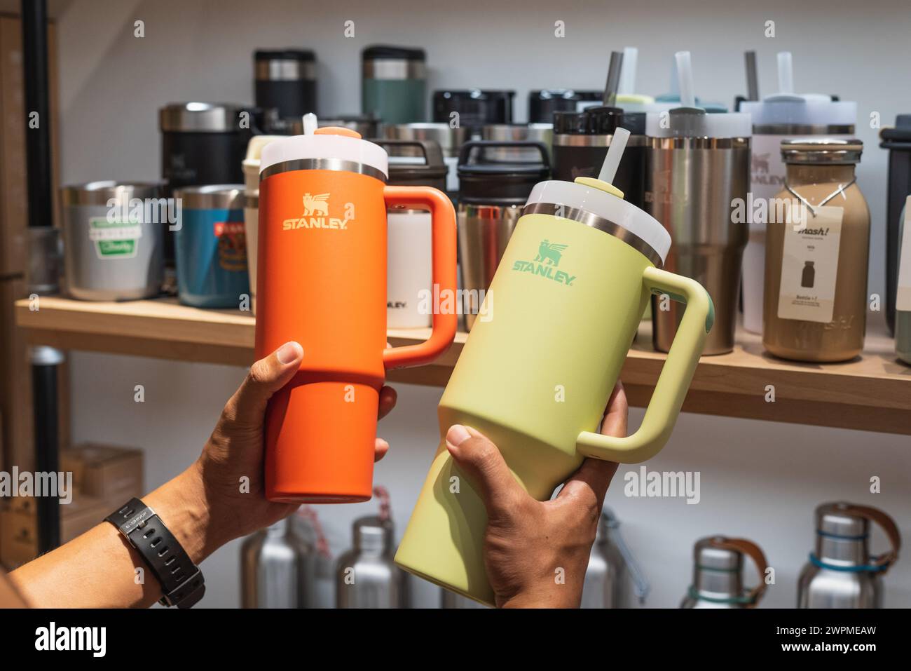 Buyer holds two Stanley tumblers in a store on March 3, 2024, in Bangkok, Thailand. Stock Photo