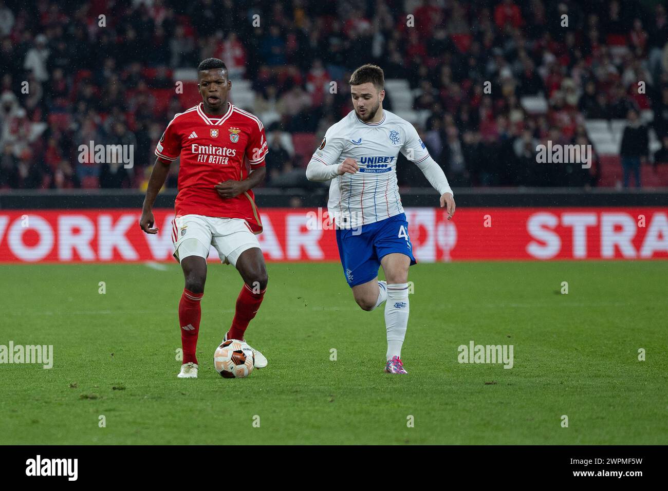 March 07, 2024. Lisbon, Portugal. Benfica's midfielder from Portugal Florentino Luis (61) and Rangers's midfielder from Belgium Nicolas Raskin (43) in action during the game of the 1st Leg of Round of 16 for the UEFA Europa League Playoffs, SL Benfica vs Rangers FC Credit: Alexandre de Sousa/Alamy Live News Stock Photo