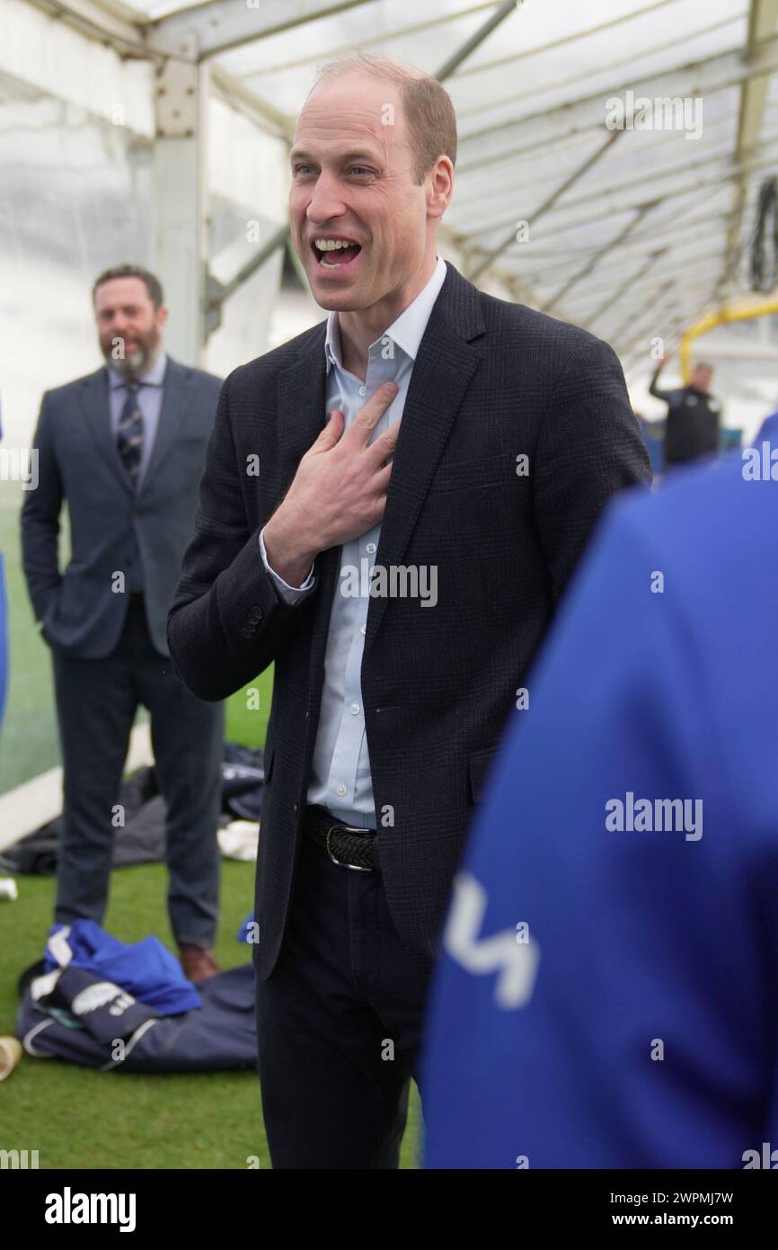 Prince William gestures as he speaks to Surrey County Cricket Club