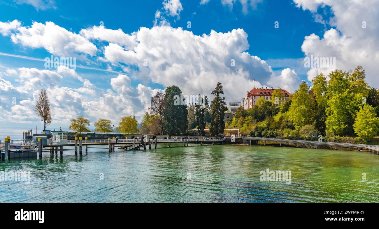 Large panorama of the pier on the east side of Mainau Island, the famous island in Lake Constance (Bodensee). Visitors are walking on the landing... Stock Photo