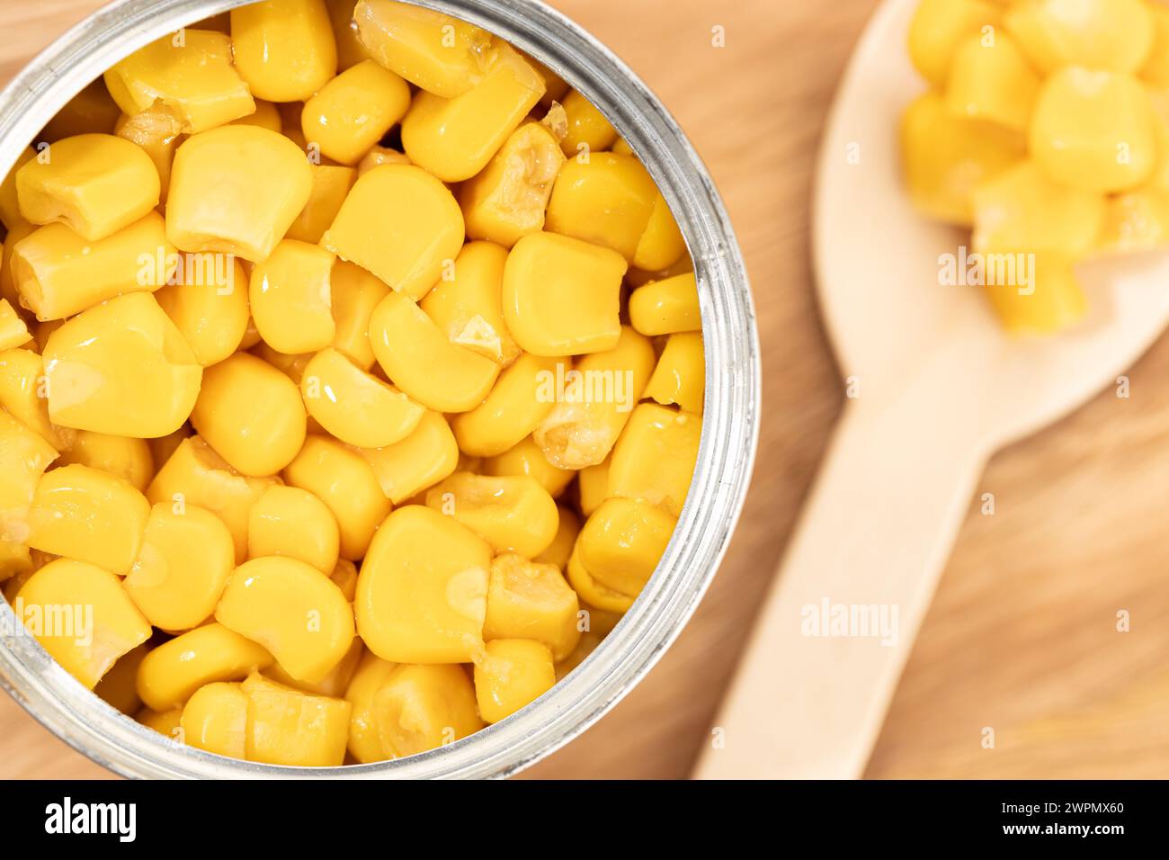 Canned Sweet Corn on wooden table Stock Photo