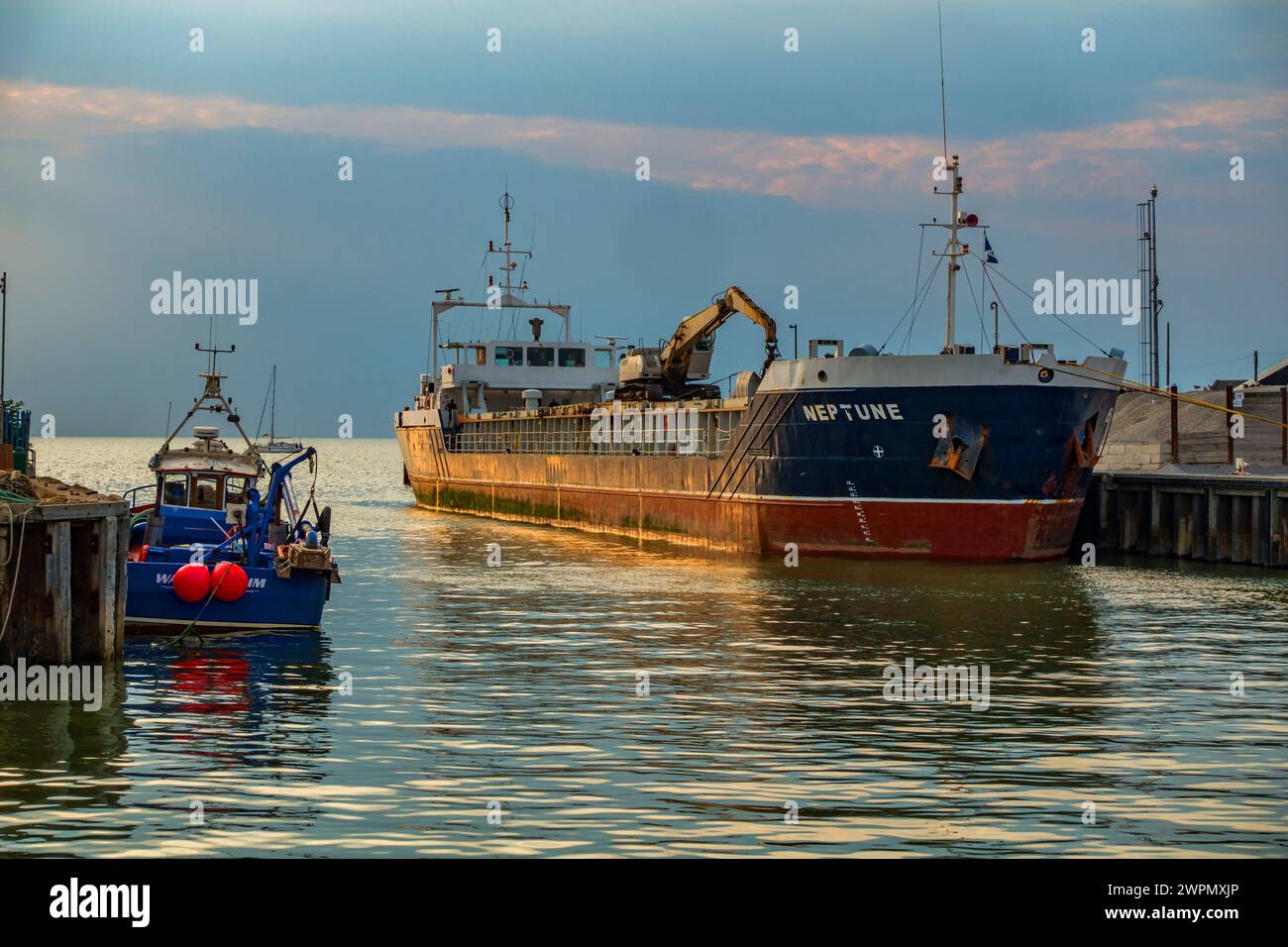 Cargo Vessel,Neptune,unloading,gravel,Bretts,Whitstable Harbour,Whitstable.Kent Stock Photo