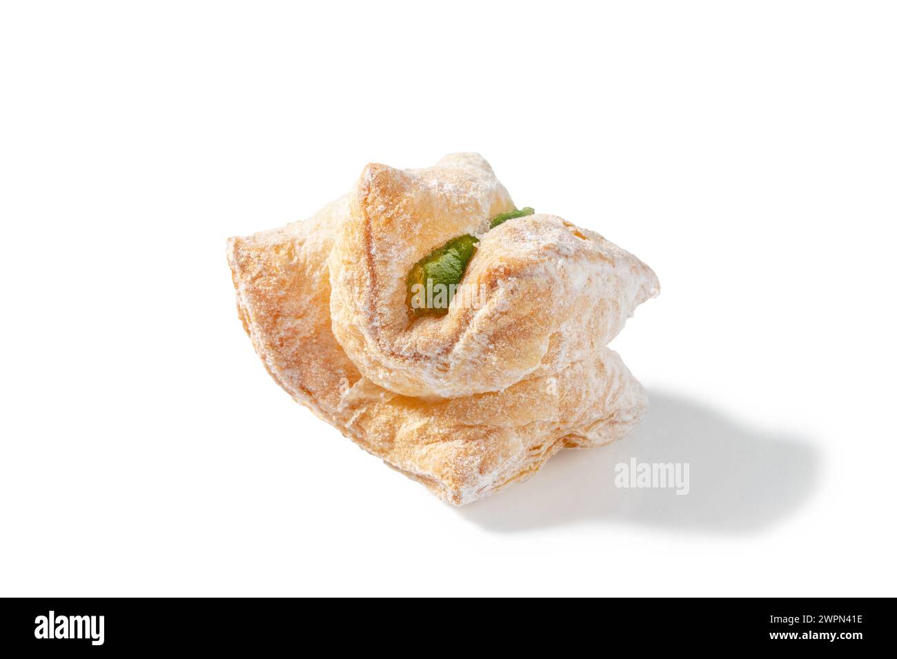 A delightful treat featuring flaky puff pastry filled with green Turkish Delight and dusted with a veil of powdered sugar Stock Photo