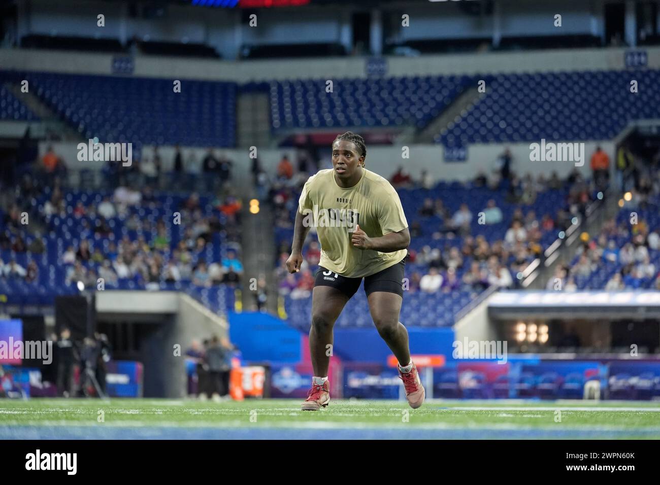 Oklahoma offensive lineman Tyler Guyton runs a drill at the NFL