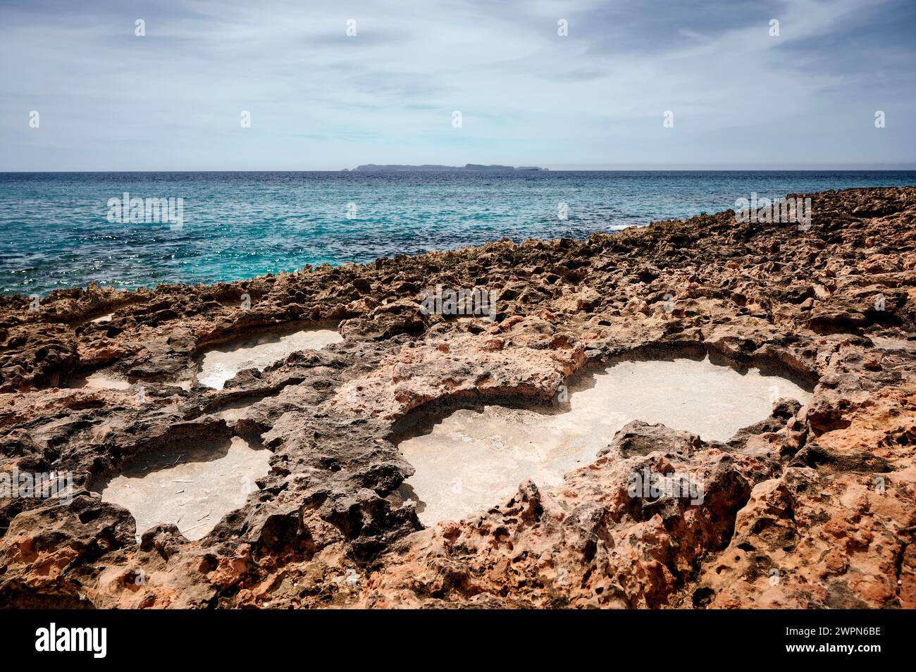 Bizarre rocky coast on Mallorca, Cap de Ses Salines, means source of salt, natural salt pan Stock Photo