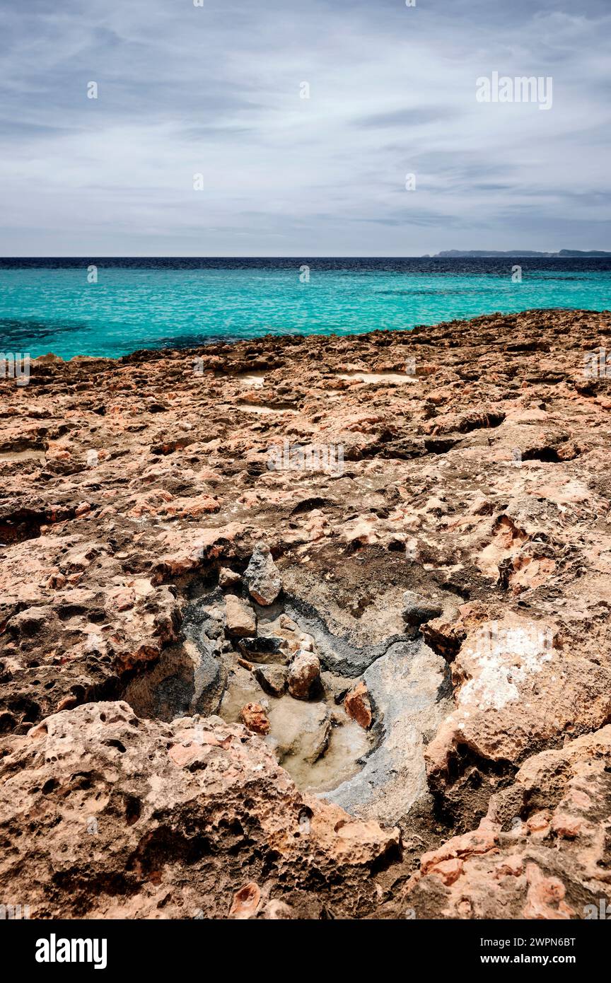Bizarre rocky coast on Mallorca, Cap de Ses Salines, natural salt pan, portrait format Stock Photo