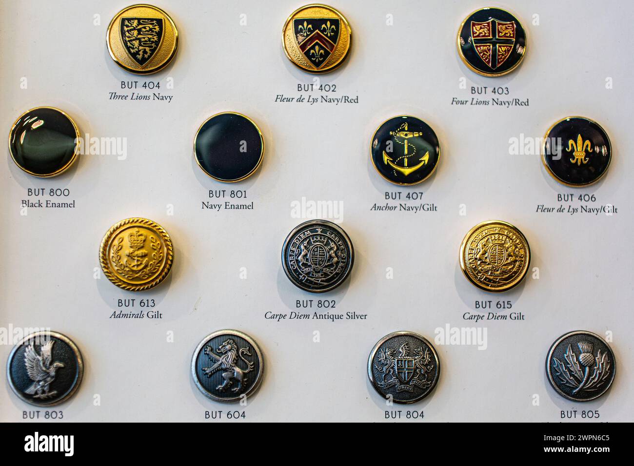 Different types of buttons display with names. Blazer buttons are made by hand using traditional techniques that have not changed in centuries. Stock Photo