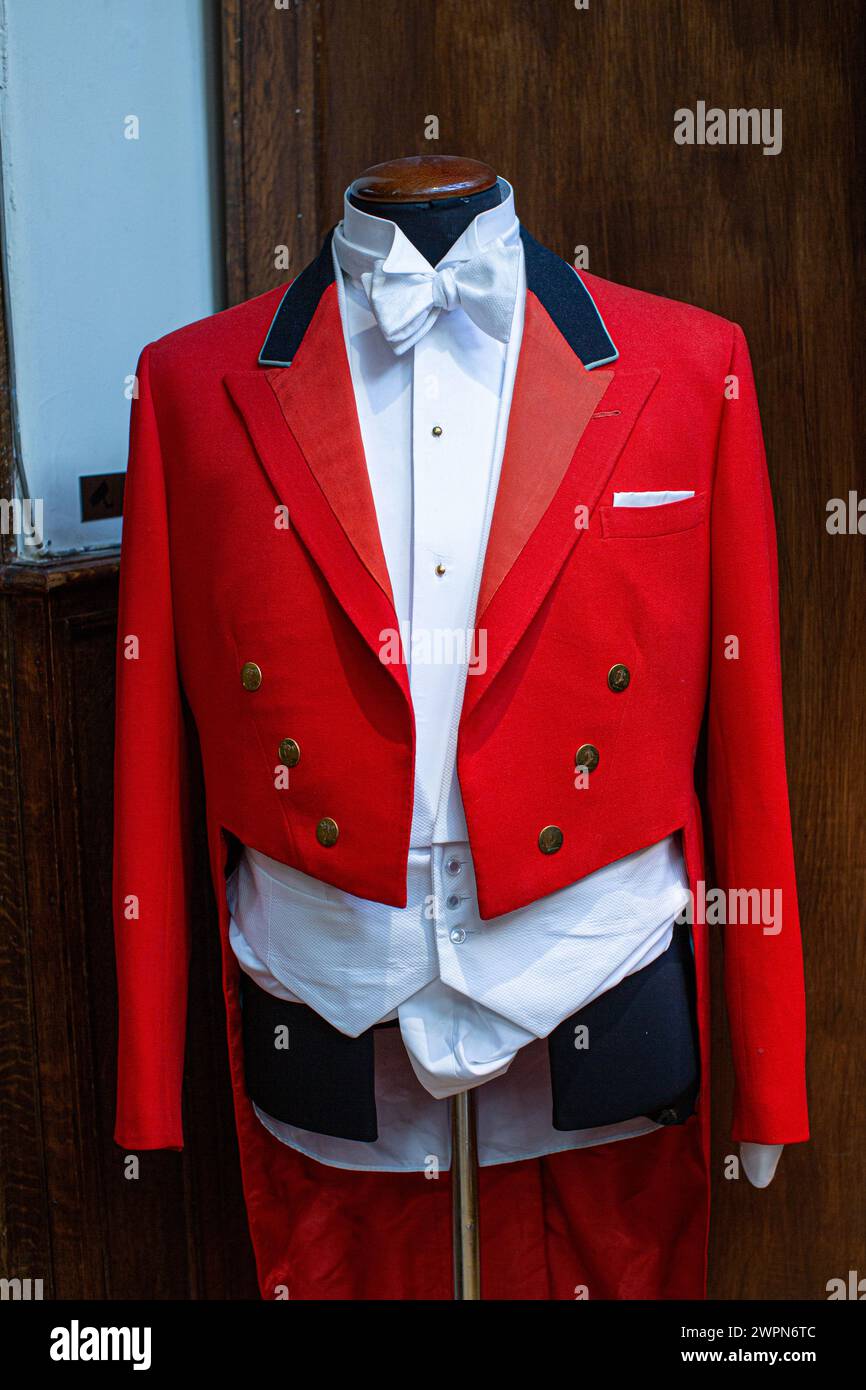 Tailored Toastmaster uniform coat in a rich red colour.Red Evening Tail coat Stock Photo