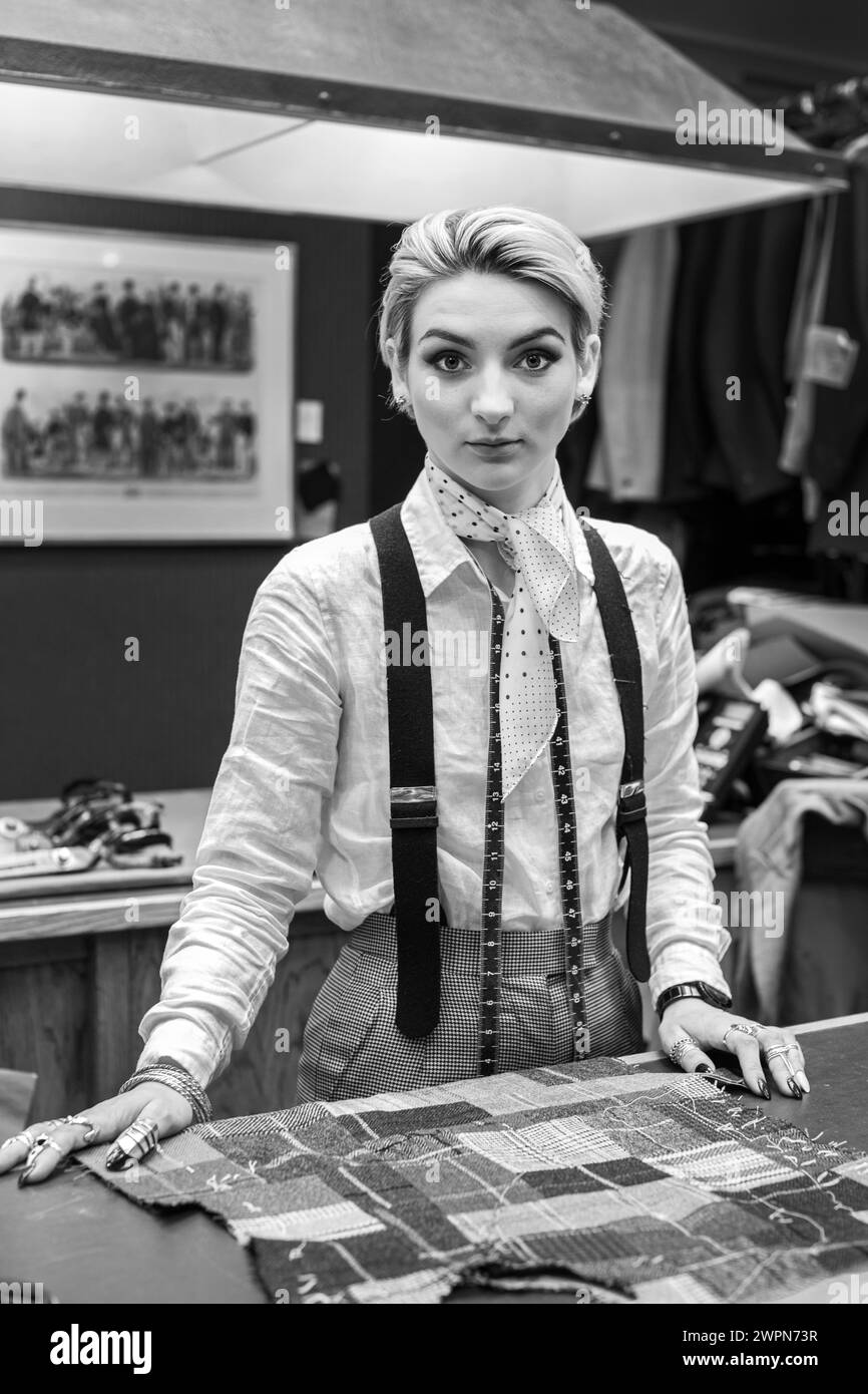 Female tailor at Huntsman Bespoke tailor at ,Savile Row, London Stock Photo