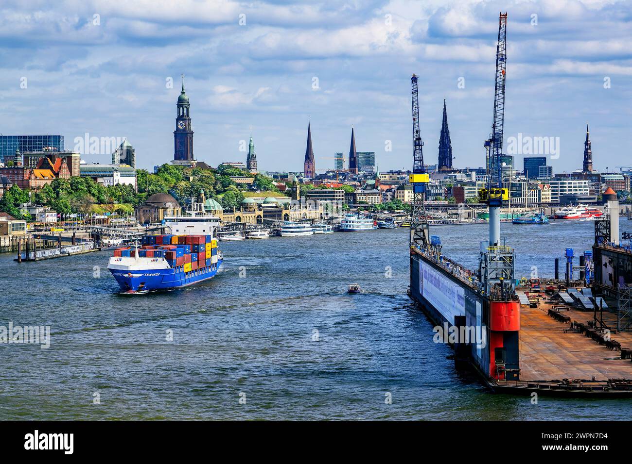 Small container ship on the Elbe in the harbor with the city skyline, Hamburg, Elbe, Land Hamburg, Germany Stock Photo