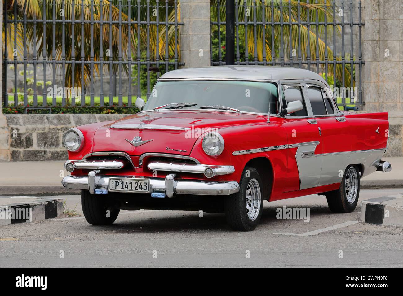 061 Oldtimer red-gray almendron car -yank tank, Dodge classic- from 1956 stationed on the Avenida del Puerto-Port Avenue. Old Havana-Cuba. Stock Photo