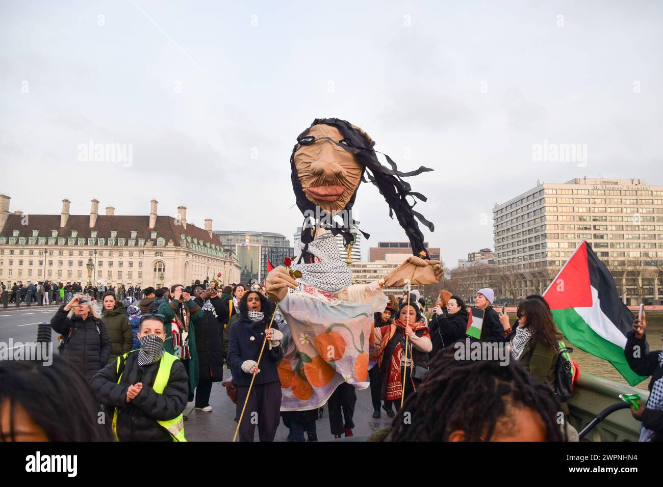 Protest Puppet London, England, UK. 8th Mar, 2024. Pro-Palestine protesters form a ...