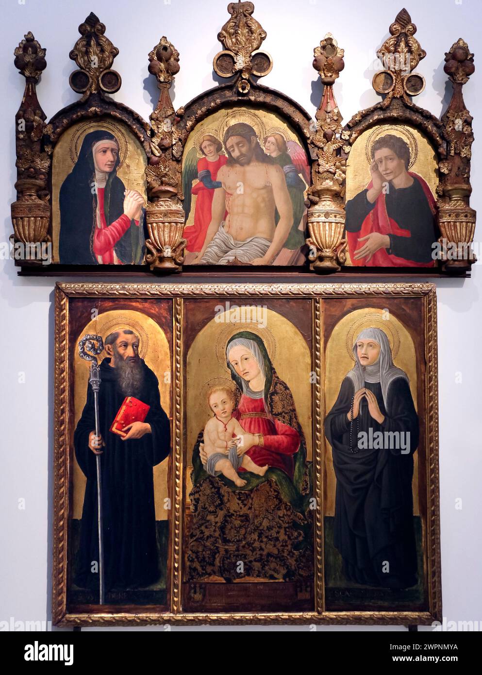 Italy Emilia Romagna Bologna - National Art Gallery - Madonna and Child with Saints Benedict and Juliana by Francesco Pelosio in 1476 Stock Photo