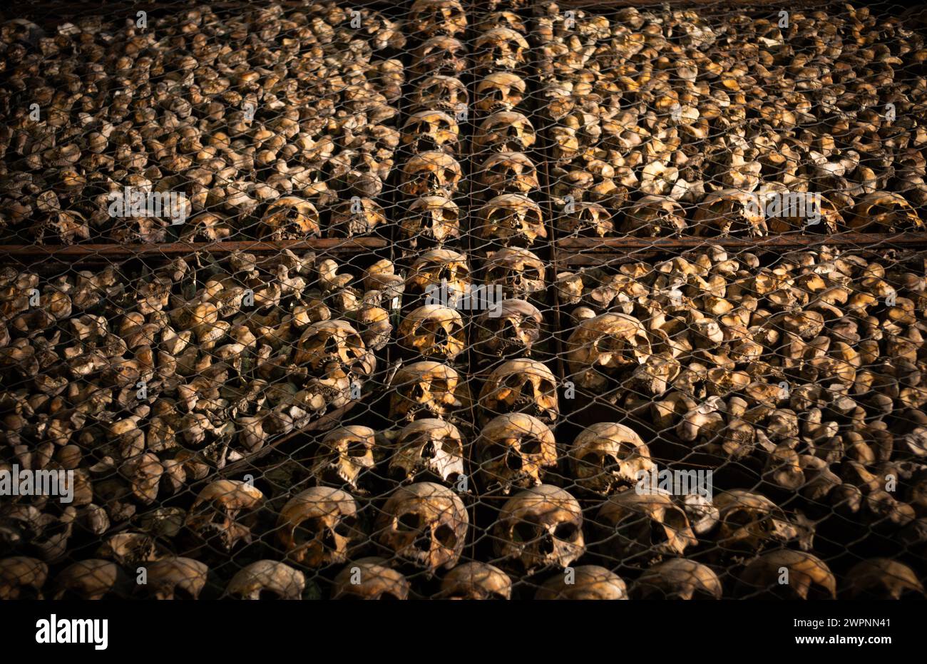 Arranged skulls and bones in the ossuary inside Chiesa di San Bernardino alle Ossa (Church of St. Bernardine of the Bones), Milan, Italy Stock Photo