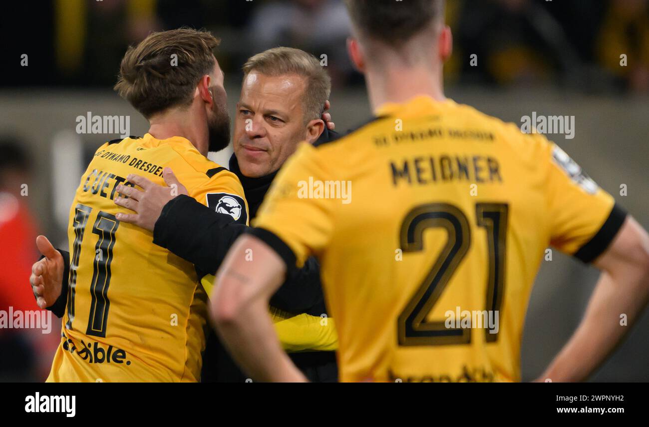 Dresden, Germany. 08th Mar, 2024. Soccer: 3rd division, SG Dynamo Dresden - TSV 1860 Munich, matchday 29, Rudolf-Harbig-Stadion. Dynamo's Lucas Cueto (l) and Dynamo coach Markus Anfang embrace after the win next to Dynamo's Robin Meißner (r). Credit: Robert Michael/dpa/ZB/dpa/Alamy Live News Stock Photo