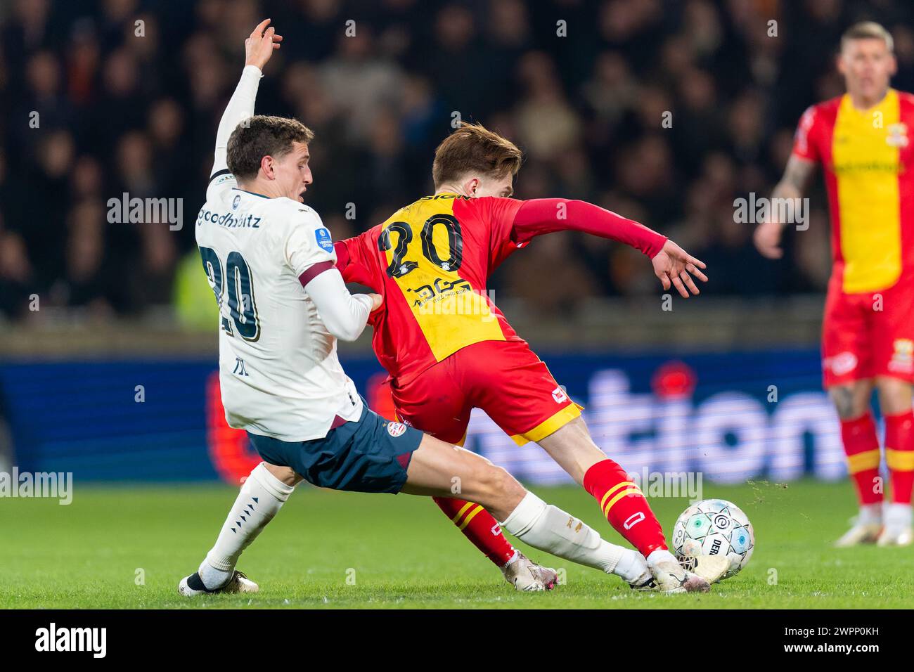 Deventer, Netherlands. 08th Mar, 2024. DEVENTER, NETHERLANDS - MARCH 8: Guus Til of PSV battles for the ball with Xander Blomme of Go Ahead Eagles during the Dutch Eredivisie match between Go Ahead Eagles of the PSV at De Adelaarshorst on March 8, 2024 in Deventer, Netherlands. (Photo by Joris Verwijst/BSR Agency) Credit: BSR Agency/Alamy Live News Stock Photo