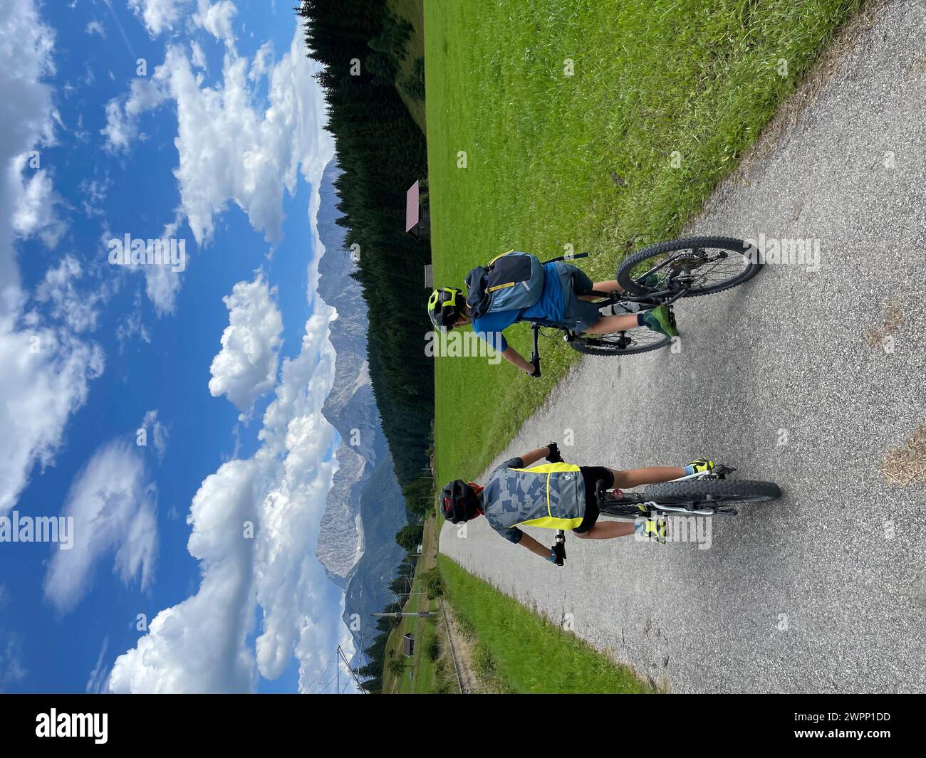 Two young cyclists on bicycle path before Klais, bicycle tour, mountain bikes, Estergebirge, Isartal, district Garmisch-Partenkirchen, nature, mountains, activity, Bavaria, Alpenwelt Karwendel, Klais, Krün, Upper Bavaria, Germany Stock Photo