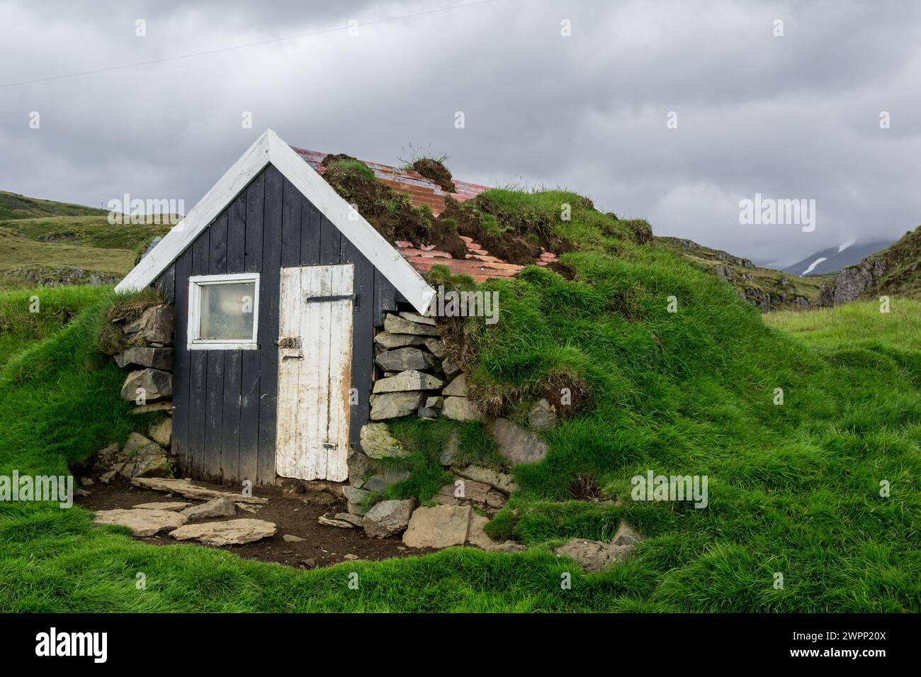 Very small turf house in Iceland, Europe at cloudy weather Stock Photo