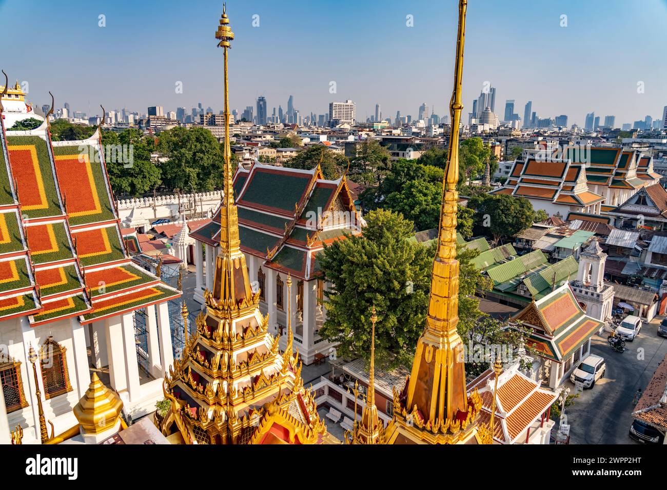 The Buddhist Temple Complex Wat Ratchanatdaram And The Skyline Bangkok the-buddhist-temple-complex-wat-ratchanatdaram-and-the-skyline-bangkok