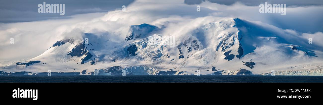 Mountains covered by glaciers, a panoramic view of the Elephant Island off the coast of Antarctica. Stock Photo