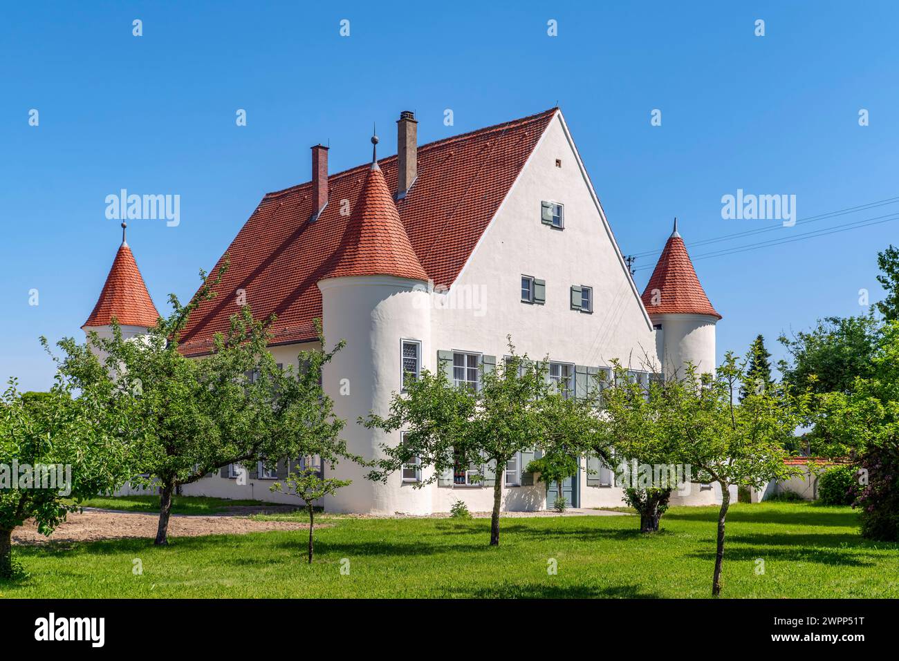 Berkheim, the rectory which was built by the Rot monastery in 1529 and baroqueized in the 17th century. It got its castle-like appearance from the four corner towers that were added in the late 18th century. Stock Photo