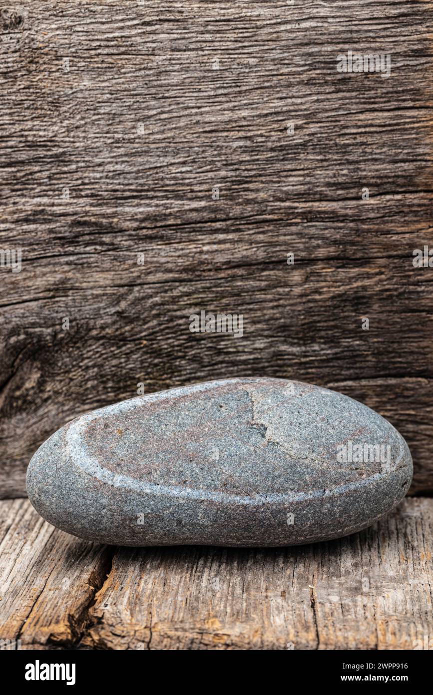 Stone on wooden background, still life Stock Photo