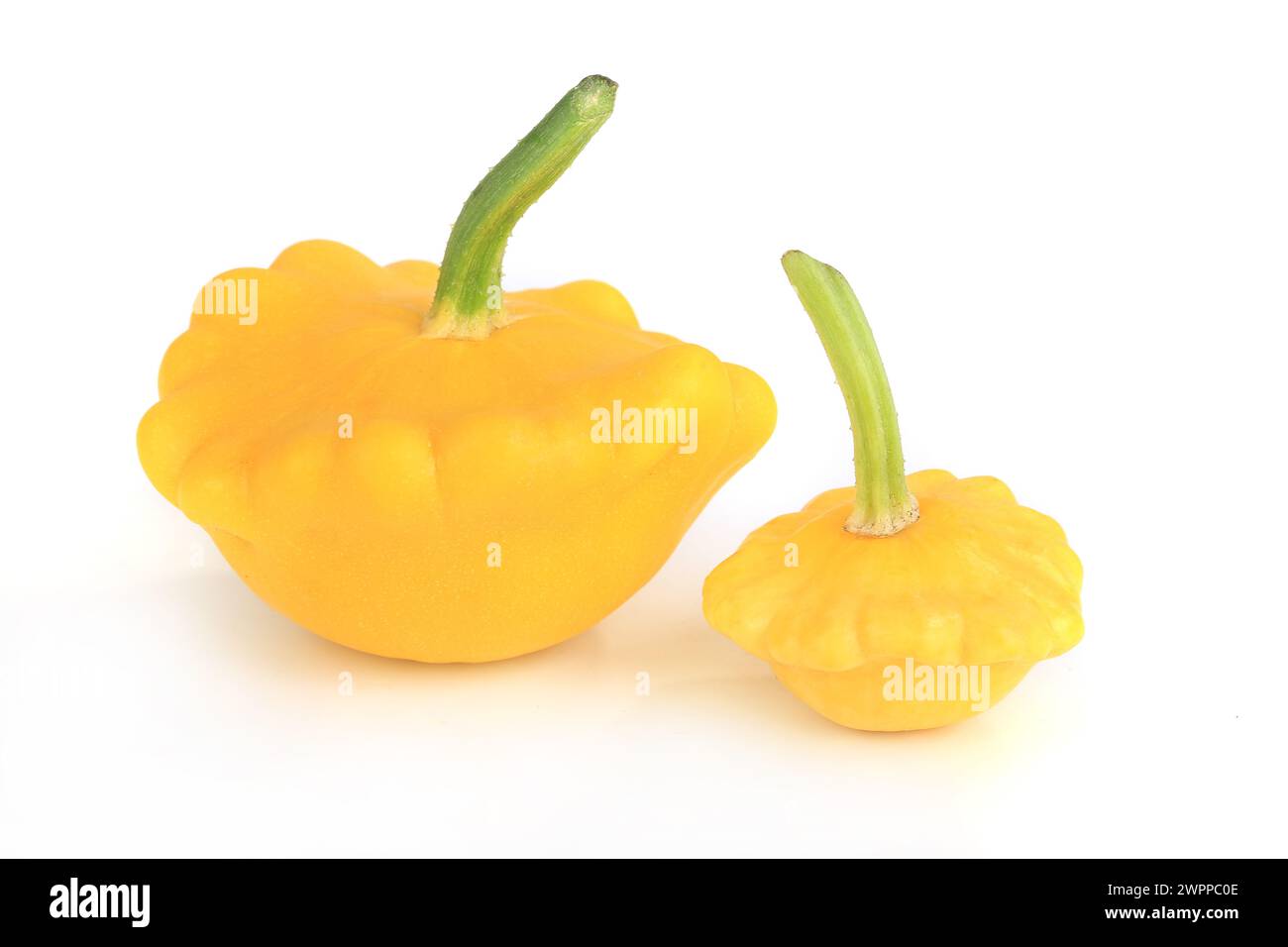 Three yellow bush pumpkins isolated on white background Stock Photo