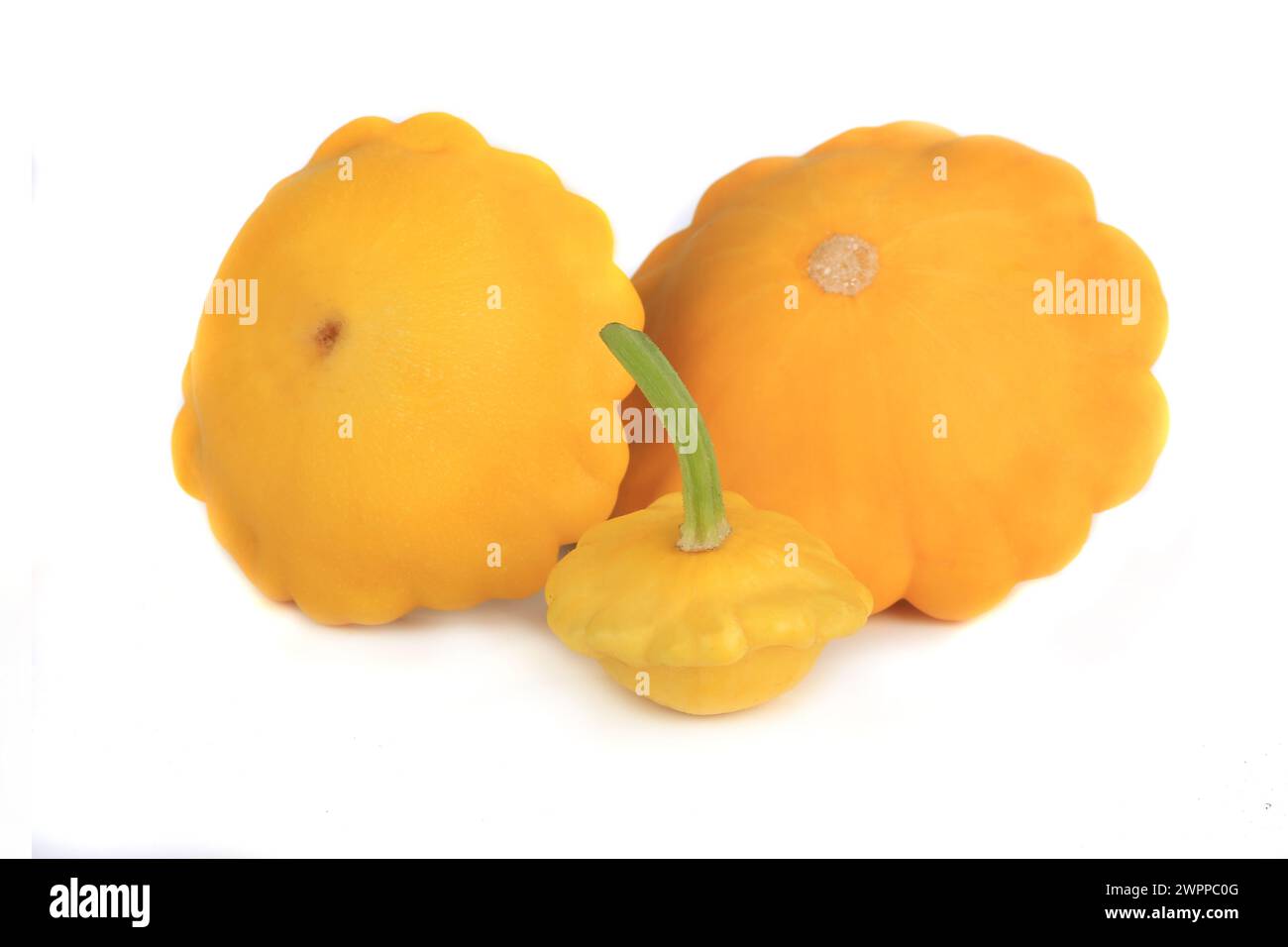 Three yellow bush pumpkins isolated on white background Stock Photo - Alamy
